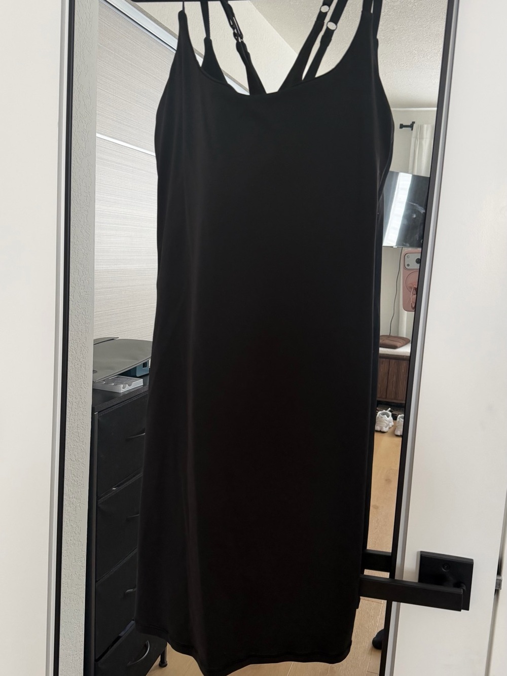 Black tennis dress with shorts underneath and adjustable straps